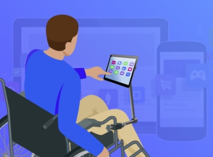 man in wheelchair using his tablet